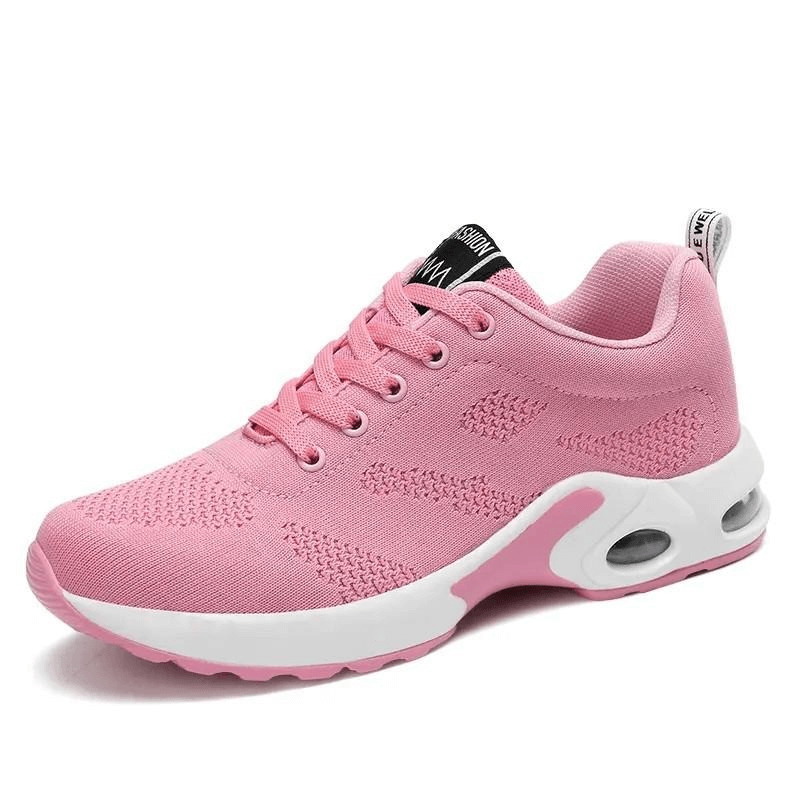 Pink breathable women's running shoe with cushioned insole and lace-up closure, perfect for flexibility and comfort in sports.